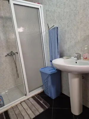 a bathroom with a shower and a sink and a sink at Casa di Morabeza in Praia