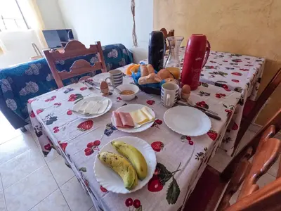 a table with plates of food on top of it at Kasa Amizade in Prainha