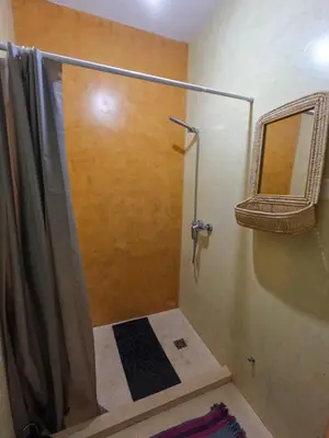 a shower with a glass door in a bathroom at Kasa Amizade in Prainha
