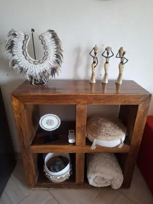 a wooden table with a mirror on top of it at Lovely Seaview Apartment Magnolia in Santa Maria