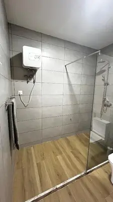 a bathroom with a shower with a toilet and a sink at Casa Fortes in Praia