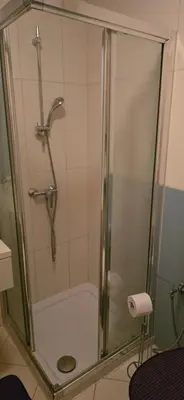 a shower with a glass door in a bathroom at Apartamento mj in Santa Maria