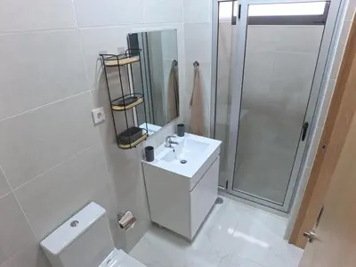 a bathroom with a toilet and a sink and a shower at Casa Guido T3, 3 Bedroom in Santa Maria