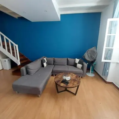 a living room with a couch and a table at FeliGrab in Mindelo