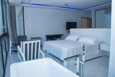 a hospital room with a bed and a chair at The View Hotel CV in São Filipe