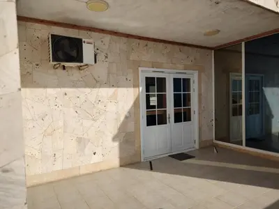 a room with a stone wall with a tv on the wall at Moreira Estates