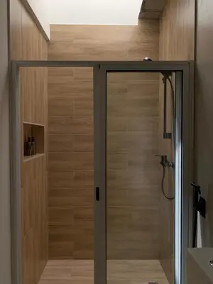a shower with a glass door in a bathroom at Alfa-Rooms in Paul