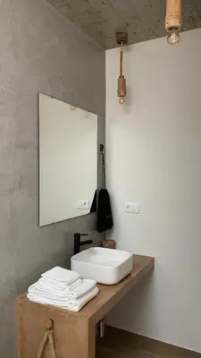 a bathroom with a sink and a mirror on a counter at Alfa-Rooms in Paul