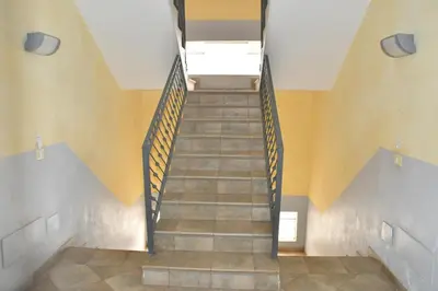 a staircase in a building with a stair case at Urban Studio Plaza 6 in Santa Maria