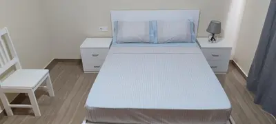 a bedroom with a bed and a chair at Sams House in Espargos