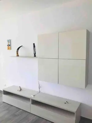 a white bench in a room with a white wall at Kite & Chill Sal Rei in Sal Rei