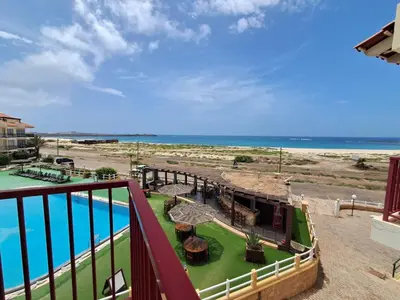 a balcony with a view of the beach and the ocean at Boa Vista BriMar Holidays, apartamento with pool in Rabil