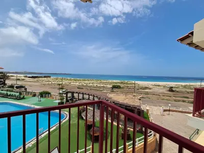 a view of the beach from the balcony of a resort at Boa Vista BriMar Holidays, apartamento with pool in Rabil