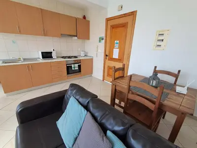 a living room with a couch and a table at Boa Vista BriMar Holidays, apartamento with pool in Rabil