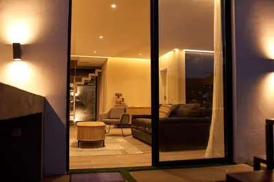 a living room with a couch and a table at CORAL BAY - Kode Villa in Cidade Velha