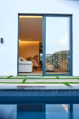 a house with a view of a pool at CORAL BAY - Kode Villa in Cidade Velha
