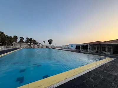 a large swimming pool with blue water at Murdeira V 17 J by RPG Group in Beirona