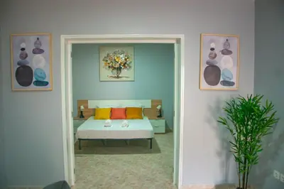 a bedroom with a bed with orange pillows at Doce de Sal in Santa Maria