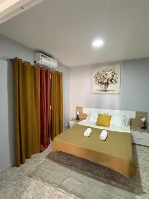 a bedroom with a bed with two towels on it at Doce de Sal in Santa Maria