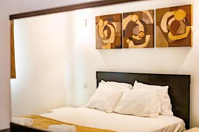 a bedroom with a bed with white pillows at HostySpot - Melia Dunas in Santa Maria