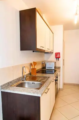 a kitchen with a sink and a counter at HostySpot - Melia Dunas in Santa Maria