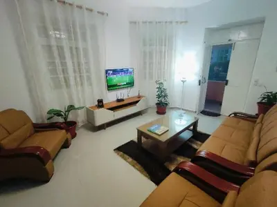 a living room with two couches and a tv at Vivenda Paraíso, Charming house on the Plateau in Praia
