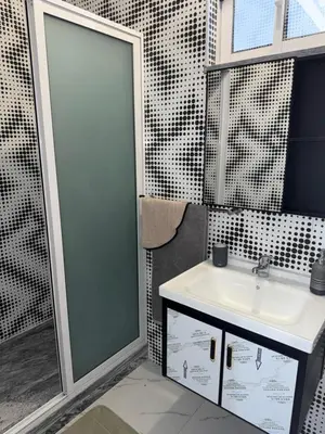 a bathroom with a sink and a mirror at Appartement Praia Sao Felipe in Praia