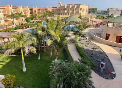 an aerial view of a resort with palm trees at Tropical Resort Pool View - Apartment in Santa Maria