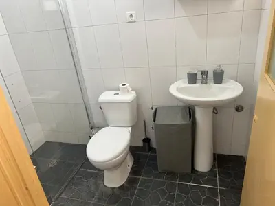 a bathroom with a toilet and a sink at Casa Ida 1 Tarrafal, Santiago, Cabo Verde in Tarrafal