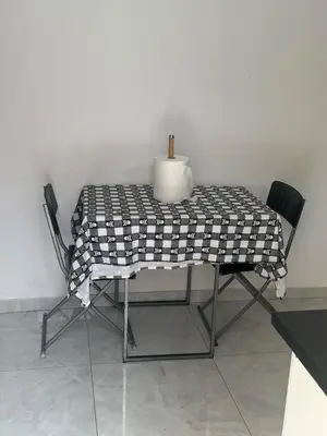 a table with a vase sitting on top of it at Casa Ida 1 Tarrafal, Santiago, Cabo Verde in Tarrafal