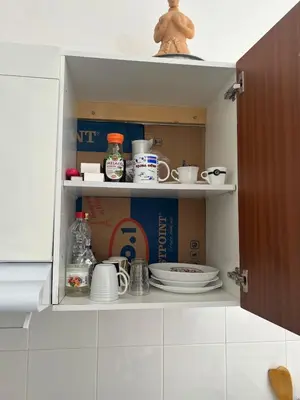 a cupboard filled with dishes and plates in a kitchen at Casa Ida 1 Tarrafal, Santiago, Cabo Verde in Tarrafal