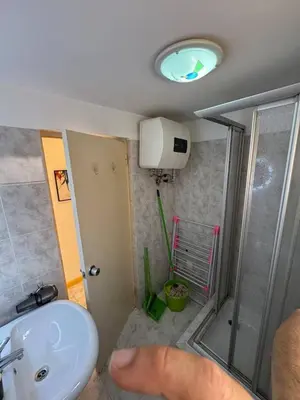 a person is pointing at a bathroom with a sink at Murdeira V 31 H by RPG Group in Beirona