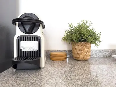 a coffee maker on a counter next to a plant at Cozy apt amazing seaview - 2 min from beach - LCGR in Tarrafal