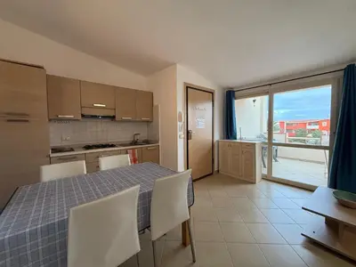 a kitchen and dining room with a table and chairs at Casa Mendonça in Santa Maria