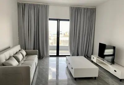 a living room with a couch and a tv at APARTAMENTO 403 T2 Centro de Sal Rei, Boavista in Sal Rei
