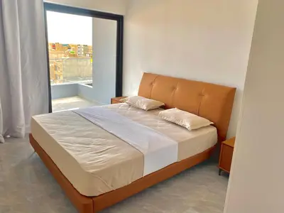 a bedroom with a large bed with a large window at APARTAMENTO 403 T2 Centro de Sal Rei, Boavista in Sal Rei