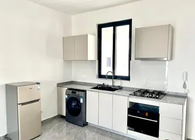 a kitchen with a washer and a sink and a dishwasher at APARTAMENTO 403 T2 Centro de Sal Rei, Boavista in Sal Rei