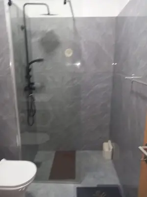 a bathroom with a glass shower with a toilet at Sal Rei ,Boavista Magic Apartment - in Sal Rei