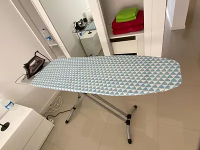 a blue umbrella sitting on a table in a room at Ponta do Sol 