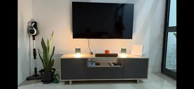 a entertainment center with a television on a wall at Ponta do Sol 