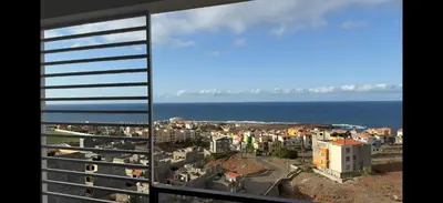 a view of the ocean from a building at Ponta do Sol 