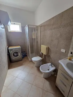 a bathroom with a shower and a toilet and a sink at T0 Bounty in Santa Maria