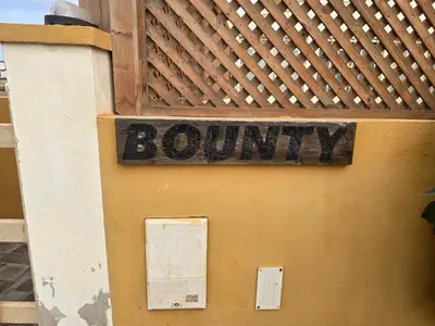 a sign that says country on the side of a building at T0 Bounty in Santa Maria