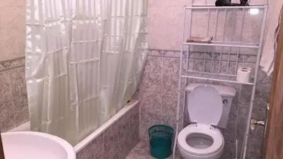 a bathroom with a toilet and a shower and a sink at Comfortable private room in Assomada in Assomada