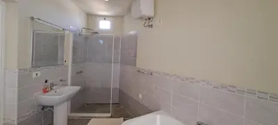 a bathroom with a sink and a toilet at Bungalow Praia de Chaves Sol & Mar in Cabeçadas