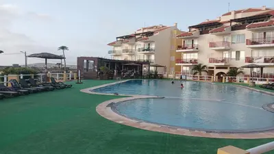 a large swimming pool in front of a building at Pandora Ocena View II in Sal Rei