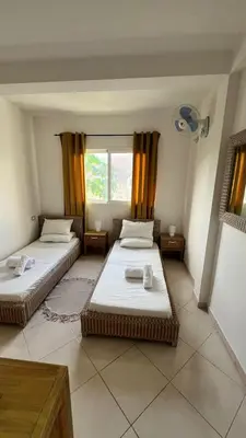 a room with two beds and a window at Estrella Do Mar Santa Maria in Santa Maria