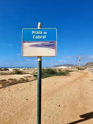 a sign on a road in the desert at A1-5101- 3 Bedroom Seaview Apartment in Cape Verde in Sal Rei