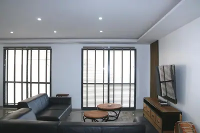 a living room with a couch and a table at Alto in Mindelo