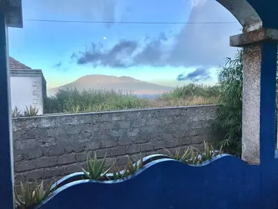 a stone wall with a view of mountains at Djabraba's Boarding Rooms in Garça